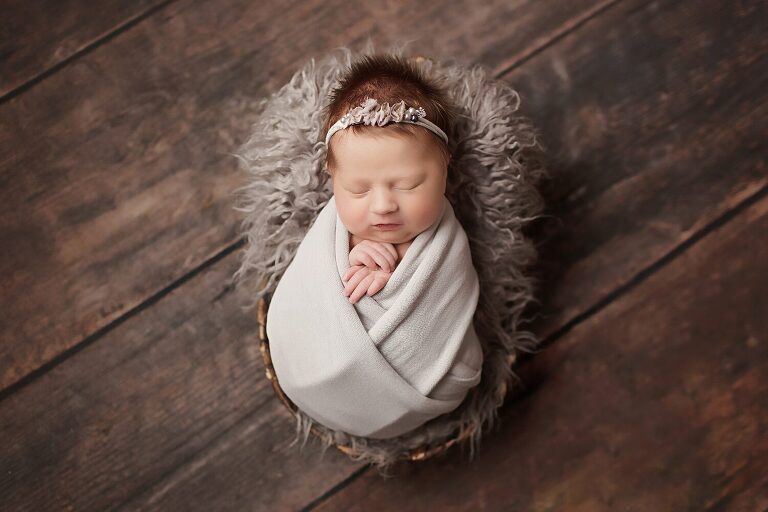 fort worth baby pictures, infant in white swaddle